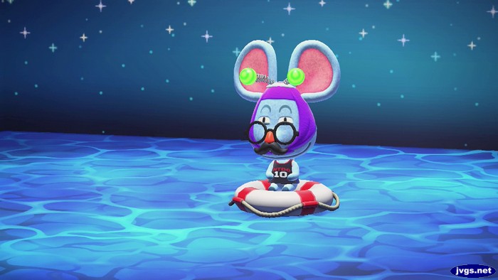 Rizzo sitting on a life ring in the middle of the ocean.