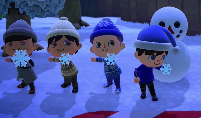 Alex, Alex, Logan, and Jeff show off snowflakes.