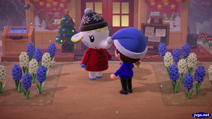 Tia wears a cute winter hat while standing in front of Nook's Cranny.