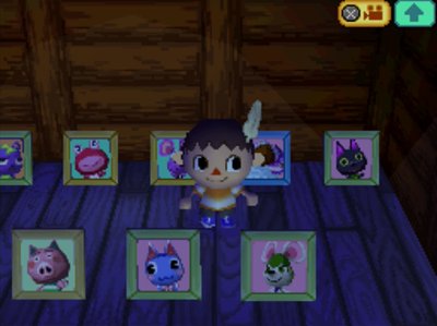 Bree's pic among other villager pics in Jeff's ACWW house.