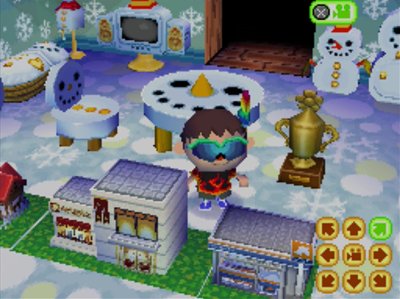 Jeff, wearing his new rainbow feather, stands in his room of snowman furniture.