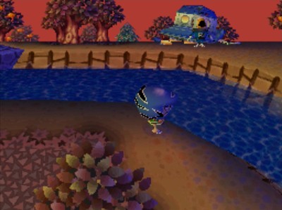 A view of Gulliver and his UFO from across the river, at sunset.