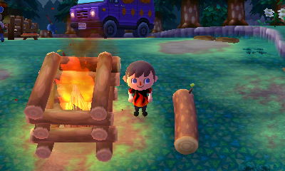 Jeff dances by the fire pit at the campground in Animal Crossing: New Leaf.