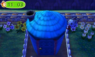 Lolly peeks out from behind her house during a game of hide-and-seek in Animal Crossing: New Leaf (ACNL) for Nintendo 3DS.