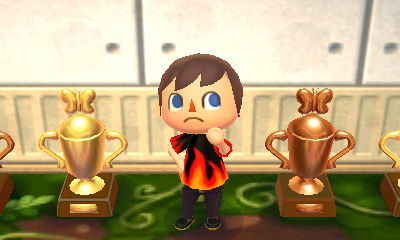 My gold bug trophy (left) and bronze bug trophy (right) in Animal Crossing: New Leaf.